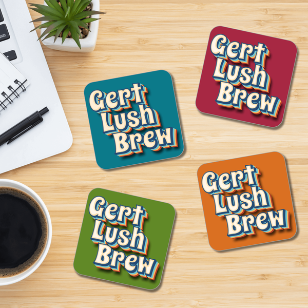 Load image into Gallery viewer, A set of square coasters with a retro style 'Gert Lush Brew' print, displayed on a wooden surface with a cup of coffee and a pen in the background.